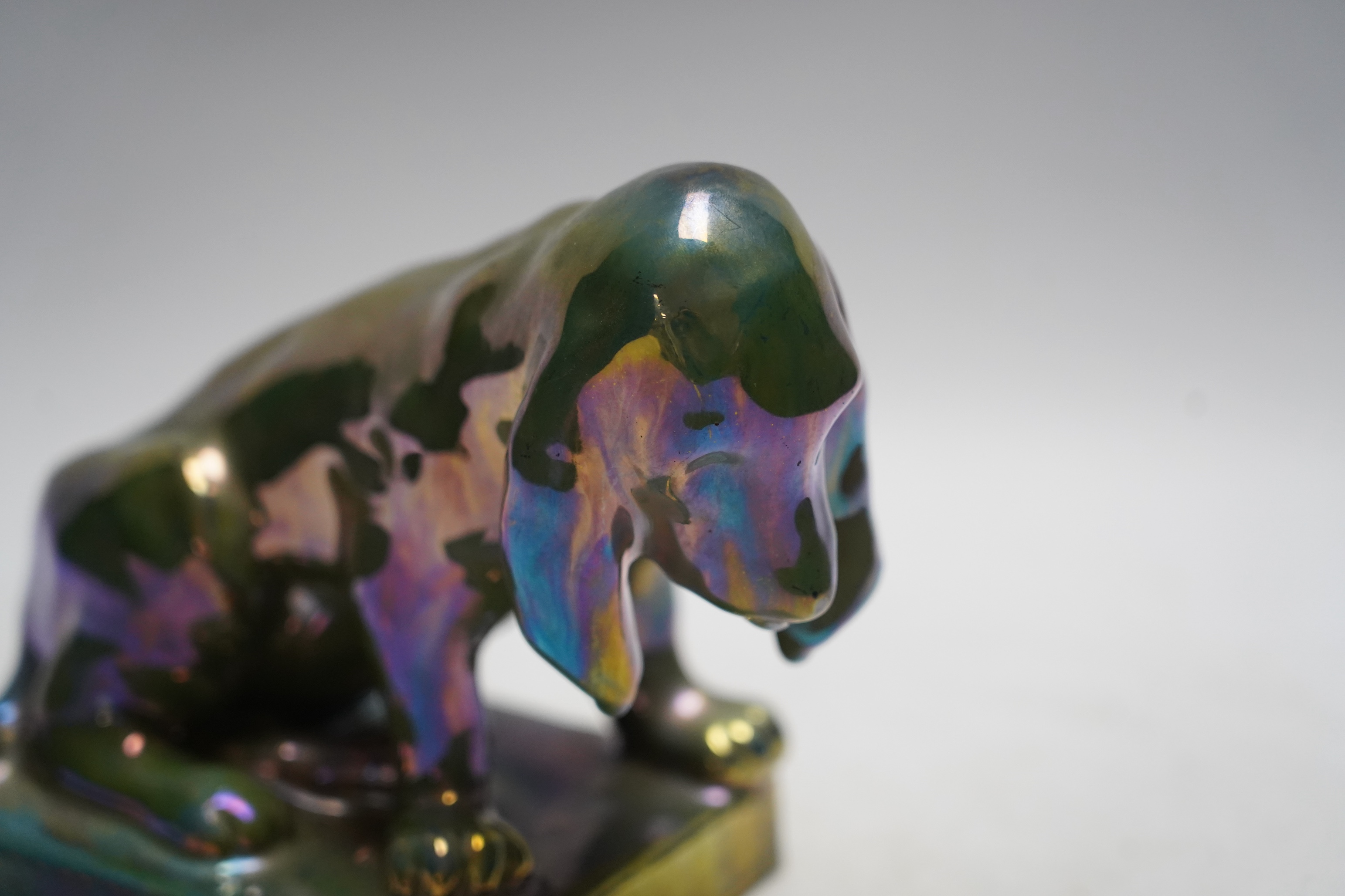 Alphonse Cytere, a French pottery lustre dog, stamped to the base, 18cm wide